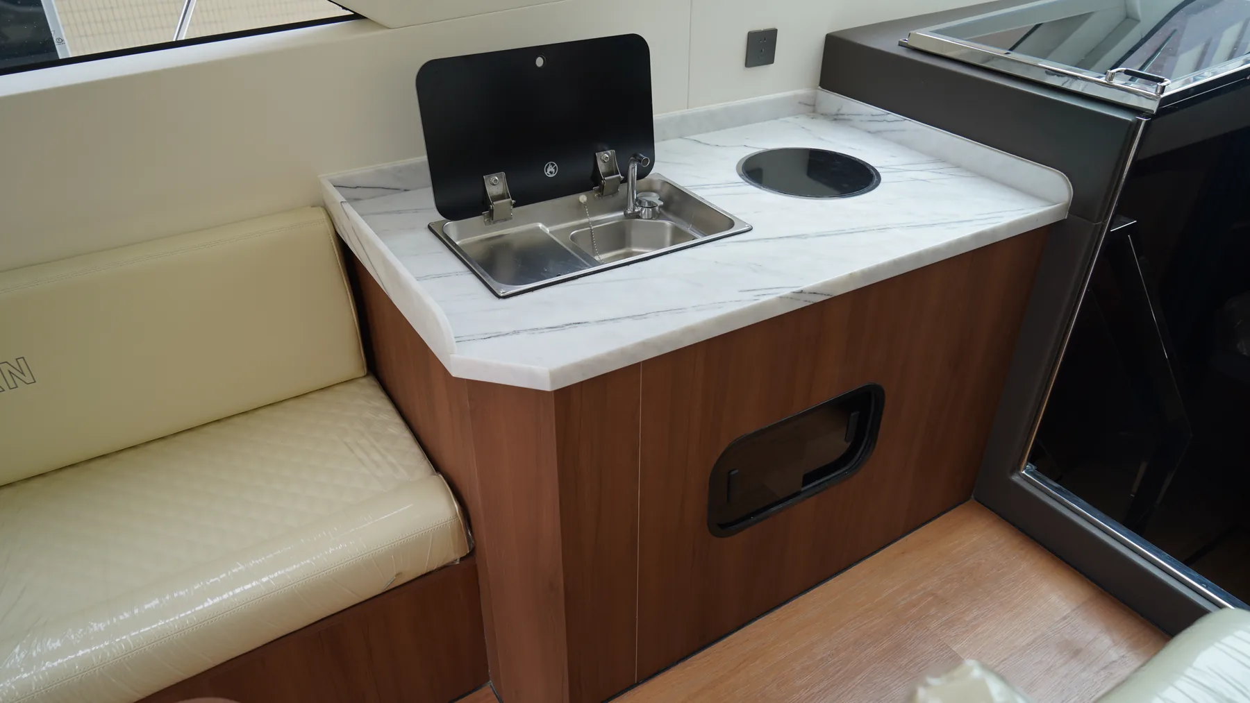 SY-410 onboard galley with sink and covered cooktop