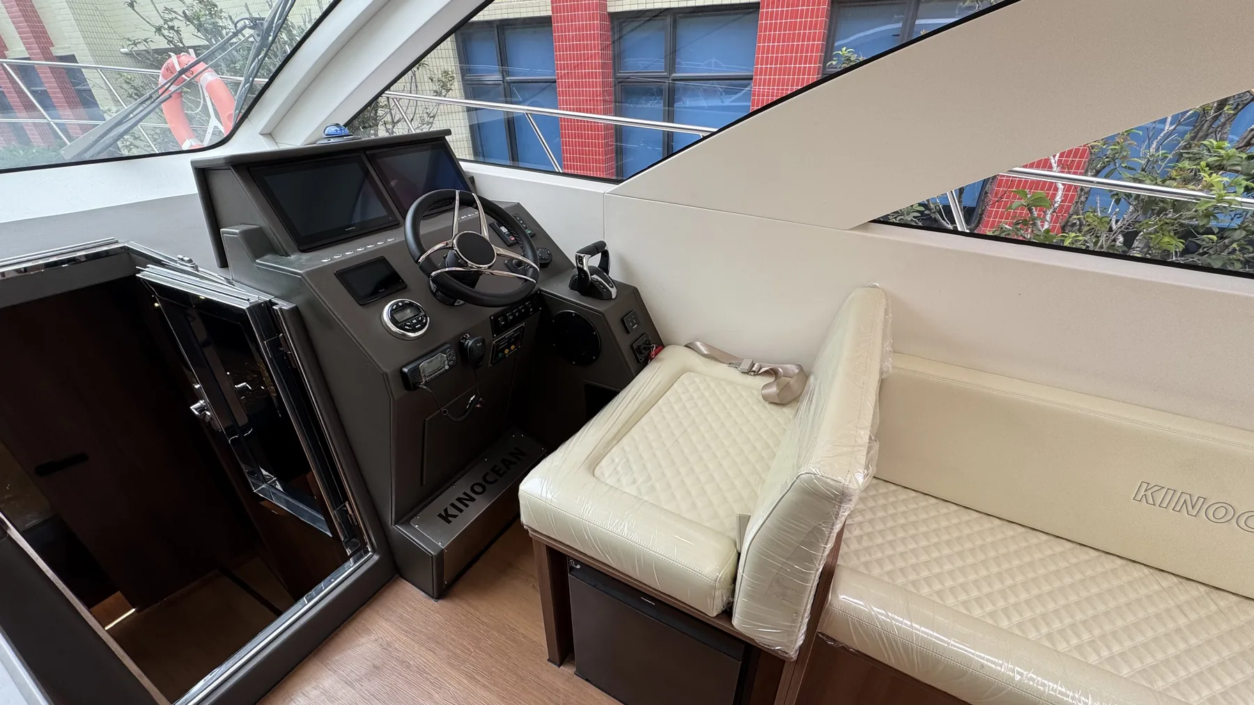 SY-410 helm console with navigation displays and companion seating